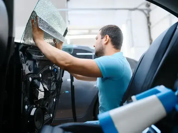 auto glass technician fixing a rock chip after an I-90 commute on Mercer Island