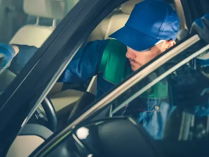 auto glass technician replacing cracked windshield at Richmond Beach home in Shoreline